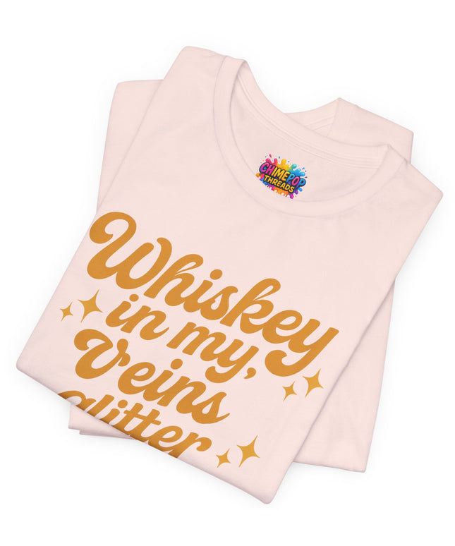 WHISKEY IN MY EYES, GLITTER IN MY VEINS GRAPHIC TEE