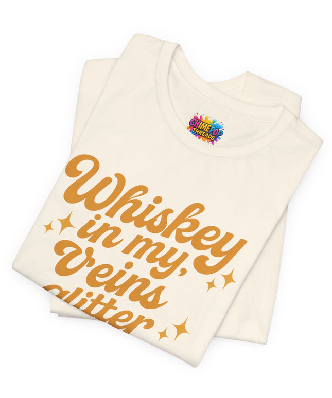 WHISKEY IN MY EYES, GLITTER IN MY VEINS GRAPHIC TEE
